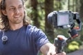 Young man filming with a camera gimbal Royalty Free Stock Photo