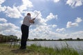 Young man fishing, Fisherman holding rod in action, Angler holding rod in action Royalty Free Stock Photo