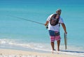 Young Man Fishing in Ocean Royalty Free Stock Photo