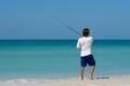 Young Man Fishing in Ocean Royalty Free Stock Photo