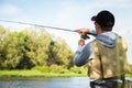 A young man fishing Royalty Free Stock Photo