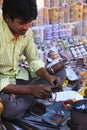 Young man fixing colorful bracelets at the market, Bundi, Rajasthan, India Royalty Free Stock Photo