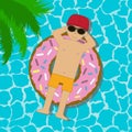 Young man floating on an inflatable circle in a swimming pool. Boy in sunglasses and cap swimming in swim ring in donut form. Royalty Free Stock Photo