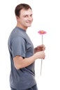 Young man with flower in hands