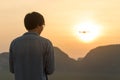 Young man flying drone and capture beautiful sunrise Royalty Free Stock Photo