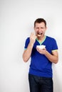 Young man forced to eat yogurt