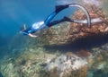 Young man freediver swim underwater, Freediving in tropical ocean at phuket islands