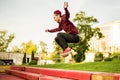 Young man freerun in summer city public park running, jumping and flying, parkour concept Royalty Free Stock Photo