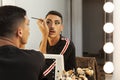 Man in front of the mirror making up drag queen artist Royalty Free Stock Photo