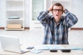 The young man frustrated at his house and tax bills Royalty Free Stock Photo