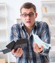 Young man frustrated at his house and tax bills Royalty Free Stock Photo