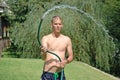 Young Man with a Garden Hose