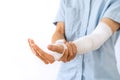 Young man with gauze bandage wrapped around injury hand Royalty Free Stock Photo