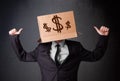 Young man gesturing with a cardboard box on his head with dollar