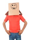 Young man gesturing with a cardboard box on his head with smiley Royalty Free Stock Photo