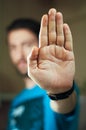 Young man gesturing stop with his hand Royalty Free Stock Photo
