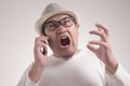 Young Man Getting Bad News on Phone, Shocked and Angry Royalty Free Stock Photo