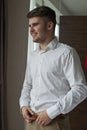 Young man getting ready for a special day. Royalty Free Stock Photo