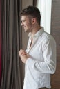 Young man getting ready for a special day. Royalty Free Stock Photo