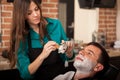 Young man getting a shave