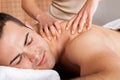 Young man getting shoulder massage Royalty Free Stock Photo