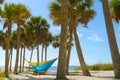 Young man and girl in hammock in beautiful beach