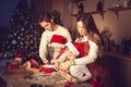 Young man and girl teach children how to cook cookies in the kitchen Royalty Free Stock Photo