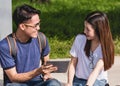 Young Man and girls friend classmates sitting consult Royalty Free Stock Photo