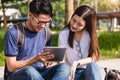 Young Man and girls friend classmates sitting consult Royalty Free Stock Photo