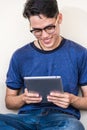 Young man and girls friend classmates sitting useing technology Royalty Free Stock Photo