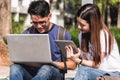 Young Man and girls friend sitting consult on laptop Royalty Free Stock Photo