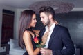 Young man give rose to lover indoor Royalty Free Stock Photo