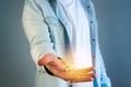 Young man giving a bulb lamp idea on a color background