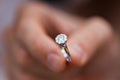 Close-up of a ring in a mans hand. young man giving engagement ring to his girlfriend. Man making marriage proposal to Royalty Free Stock Photo