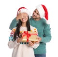 Young man giving gift box to his girlfriend. Christmas celebration Royalty Free Stock Photo