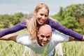 Young man giving shoulder ride to her girlfriend Royalty Free Stock Photo