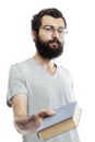 A young man in glasses and with a beard with a book in his hand. Education and training. Isolated on a white background. Vertical