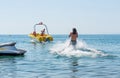 Young man glides on water skiing on the waves on the sea, ocean. Healthy lifestyle. Positive human emotions, feelings, Royalty Free Stock Photo