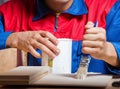 Young man gluing wood pieces together in DIY concept