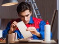 Young man gluing wood pieces together in DIY concept