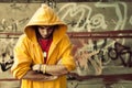 Young man on graffiti grunge wall Royalty Free Stock Photo