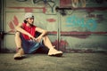 Young man on graffiti grunge wall Royalty Free Stock Photo