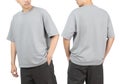 Young man in grey oversize t-shirt mockup front and back used as design template, isolated on white background with clipping path Royalty Free Stock Photo