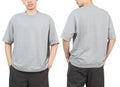 Young man in grey oversize t-shirt mockup front and back used as design template, isolated on white background. Royalty Free Stock Photo