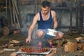 Young man doing a barbecue Royalty Free Stock Photo