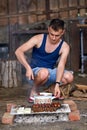 Young man doing a barbecue Royalty Free Stock Photo