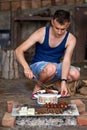 Young man doing a barbecue Royalty Free Stock Photo