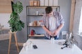 young man grinding coffee at home , making coffee in the morning Royalty Free Stock Photo