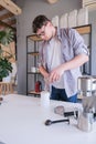 young man grinding coffee at home , making coffee in the morning Royalty Free Stock Photo