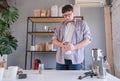 young man grinding coffee at home , making coffee in the morning Royalty Free Stock Photo